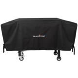 Black Blackstone 1528 cover fitted over a 36 inch griddle cart, its side straps hanging above the caster wheels