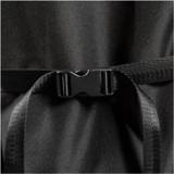 Close up of a black plastic side release buckle joining two webbing straps on the cover's polyester fabric