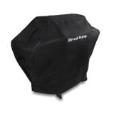 Black Broil King 58 inch Premium grill cover on a gas grill, logo on the lid and a handle on top