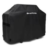 Black Broil King 58 inch Premium cover over a gas grill, seen from the front corner on a white background