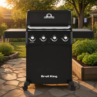 Broil King Crown 410 Shadow in black, lid closed, both side shelves raised and four knobs across the front