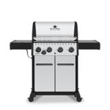 Broil King Crown S 440 with a stainless lid and cabinet doors, black shelves out, four knobs and a side burner knob