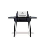 Broil King Porta-Chef 120 portable gas grill, lid closed, black cast cook box with stainless lid face, standing on four black snap-in legs