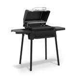 Porta-Chef 120 with the lid raised, cast iron cooking grid and chrome warming rack visible inside the cook box