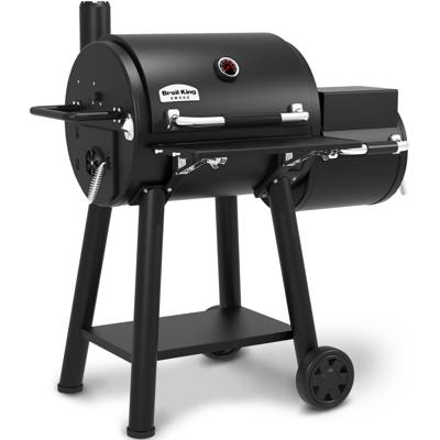 Broil King Regal 400 Charcoal Offset, black steel barrel cooker with a smaller offset chamber at right and two wheels.