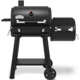 Broil King Regal 400 Charcoal Offset, front three-quarter view, lid closed, offset chamber at the right