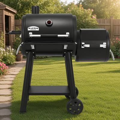 Broil King Regal 400 Charcoal Offset, black steel barrel cooker with a smaller offset chamber at right and two wheels.