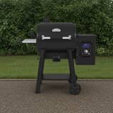 Broil King Regal Pellet 400 pellet grill, black barrel lid with stainless handle, side hopper and lit digital controller