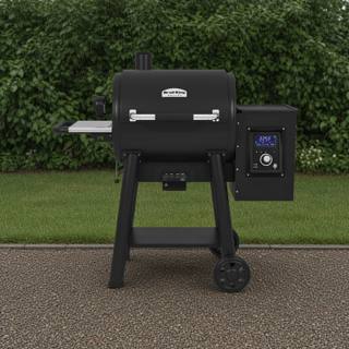 Broil King Regal Pellet 400 pellet grill, black barrel lid with stainless handle, side hopper and lit digital controller
