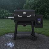 Broil King Regal Pellet 500 in profile, barrel lid, stainless handle, side shelf and hopper-mounted controller