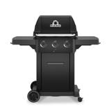 Broil King Royal 320 Shadow gas grill in matte black, lid closed, side shelves out, cabinet door shut