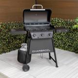 Char-Broil 3-Burner Gas Grill on a patio with the lid open, empty wire grates and a covered propane tank at left