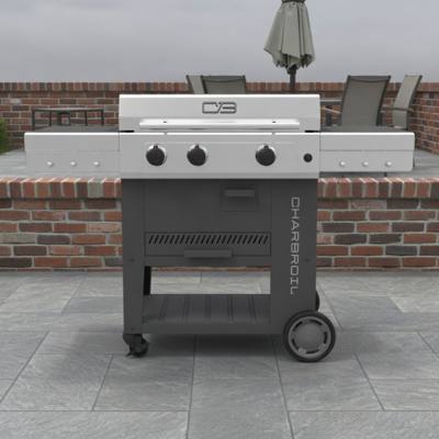 Char-Broil Versa-Tile 28 griddle on a paved patio, stainless lid closed, three knobs, dark cart with two side shelves out