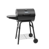 King-Griller Gambler E1416 barrel charcoal grill on its four-leg cart, lid shut, side shelf out, on a stone terrace