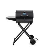 King-Griller Gambler E1816 charcoal grill in black, lid shut, side shelf out, standing on its folding cart