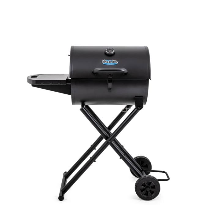 King-Griller Gambler E1816 charcoal grill in black, lid shut, side shelf out, standing on its folding cart