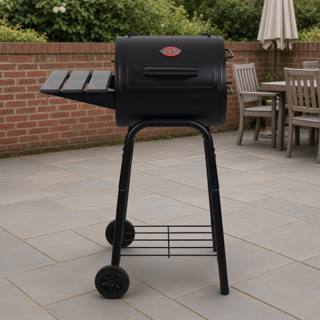 Char-Griller Patio Pro barrel charcoal grill with its slatted side shelf, on a patio with a brick wall