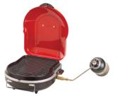 Coleman 2000020932 open on white, ribbed cooktop under a raised red lid, regulator arm out to a propane cylinder