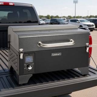 Cuisinart CPG-256 portable wood pellet grill, lid closed and latched, stainless carry handle above a lit control panel