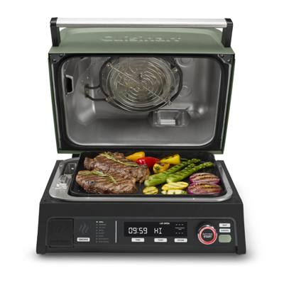 Cuisinart FlavorBoost CEG-1302 with its green lid open, steak and vegetables on the grill plate, panel lit