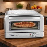 Cuisinart CPZ-120 indoor pizza oven in brushed stainless, a baked pizza on the stone behind the window, dial at right