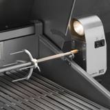 DCS rotisserie motor housing with the Smart Beam halogen light lit, spit rod engaged and a fork on the rod