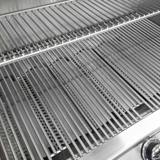 Close-up of the C430i Diamond Sear cooking grids with the stainless warming rack above them