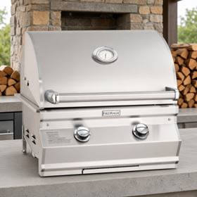 Fire Magic CM430i stainless grill head on a stone counter, hood closed with an analog thermometer and two control knobs