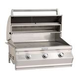 Fire Magic CM540 with the hood open, stainless warming rack above the full width of the cooking grids