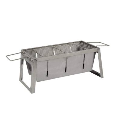 Fire Sense foldaway stainless charcoal grill standing open on its legs, wire grate on top, wire handles hooked at each end