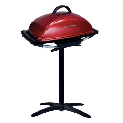 Red George Foreman GFO201R with its domed lid shut, sitting on a black pedestal stand with a four-footed base