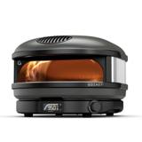 Gozney Arc propane pizza oven, front view, flame rolling up the left wall and the digital readout lit