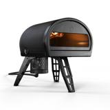 Gozney Roccbox pizza oven in black on its folding legs with the gas burner attached