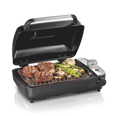 Hamilton Beach 25375 indoor searing grill, cover raised, steaks and asparagus on the plate, smoke chamber at right
