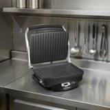 Hamilton Beach 25331 open on a stainless prep bench, both ribbed plates and the lit control strip in view