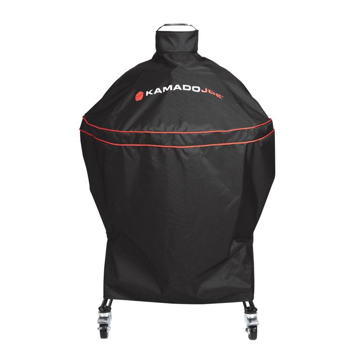 Black Kamado Joe Big Joe cover with two red piping bands and a loop handle on top, over a cart grill with casters below
