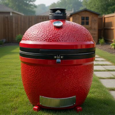 Red Kamado Joe Big Joe II standing on its own ceramic feet with no cart, stainless ash drawer at the base