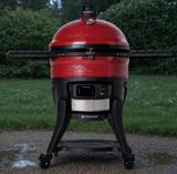 Red Kamado Joe Big Joe Konnected Joe on its black steel cart, side shelves out, control panel below the dome