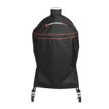 Black Kamado Joe cover with red piping and a top loop handle over a Classic Joe on its cart, casters showing below
