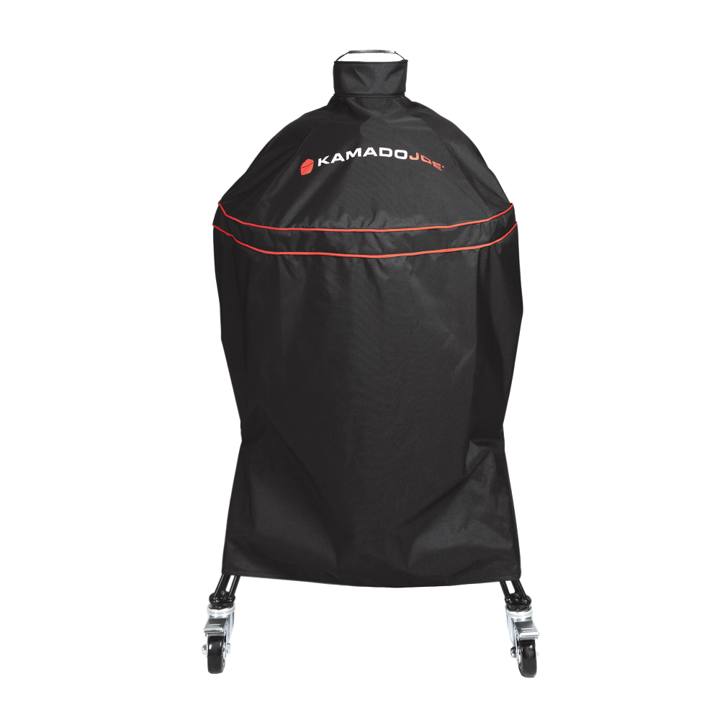 Black Kamado Joe cover with red piping and a top loop handle over a Classic Joe on its cart, casters showing below