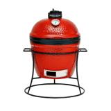 Red Kamado Joe Joe Jr ceramic grill with dome thermometer and black top vent, sitting in its round cast iron stand