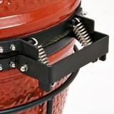 Close-up of the Joe Jr rear hinge, two steel springs on a black bracket bolted to the red ceramic lid and base