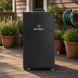 Masterbuilt 30 inch digital electric smoker on a wooden deck beside potted plants and a garden hose reel