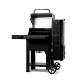 Gravity Series 600 at a three-quarter angle on white, lid raised to show the warming rack, hopper tower and two wheels