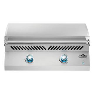 Napoleon Built-in 700 Series 32 griddle head, stainless lid down, two blue lit control knobs on the front panel