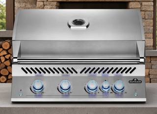 Napoleon Built-in 700 Series 32 stainless grill head with the lid closed and five blue lit control knobs