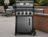 Graphite grey Napoleon Freestyle 425 with four knobs, a closed lid, one cabinet door and both side shelves raised