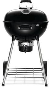 Napoleon NK22 black kettle grill with the lid shut, standing on four legs with two wheels and a wire rack