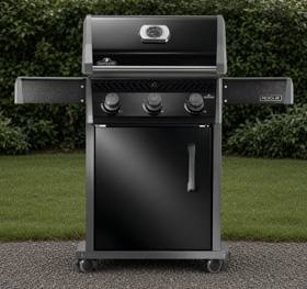 Napoleon Rogue 425 propane grill in black with three knobs, a closed lid and both side shelves raised