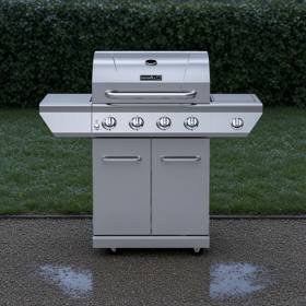 Stainless Nexgrill four-burner gas cart on wet gravel, rain-beaded lid, five knobs and two cabinet doors